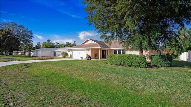 ranch-style house with a garage and a front yard