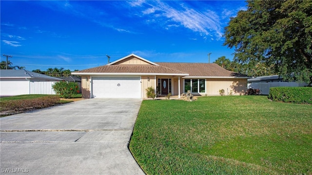 single story home featuring a garage and a front lawn