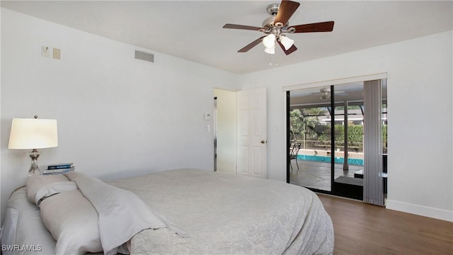 bedroom with dark wood-type flooring, access to outside, and ceiling fan