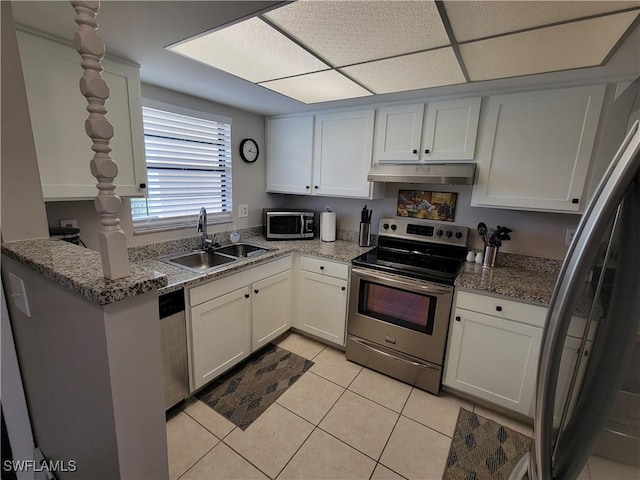 kitchen featuring sink, stainless steel appliances, white cabinets, and stone counters