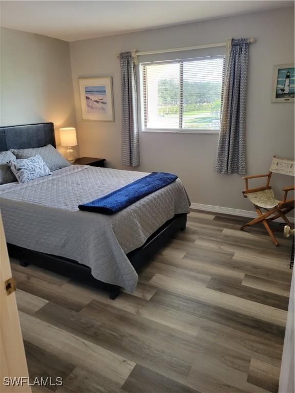 bedroom with wood-type flooring