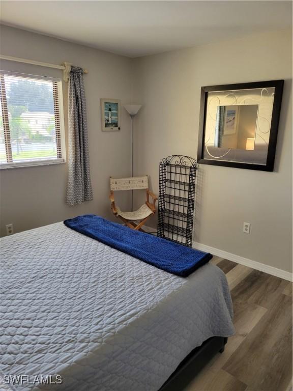 bedroom with hardwood / wood-style floors