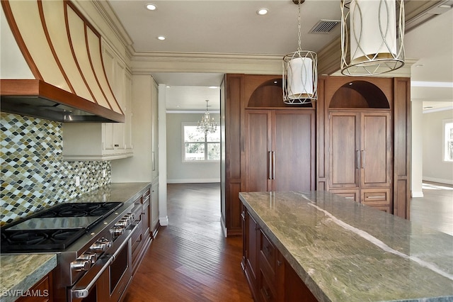 kitchen featuring ornamental molding, double oven range, stone countertops, and custom exhaust hood