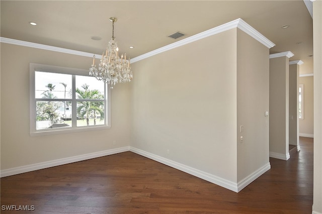 unfurnished room with an inviting chandelier, crown molding, and dark hardwood / wood-style floors