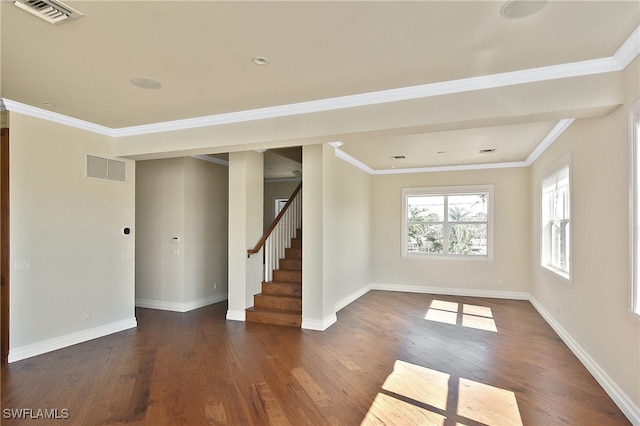 unfurnished room with ornamental molding and dark hardwood / wood-style floors