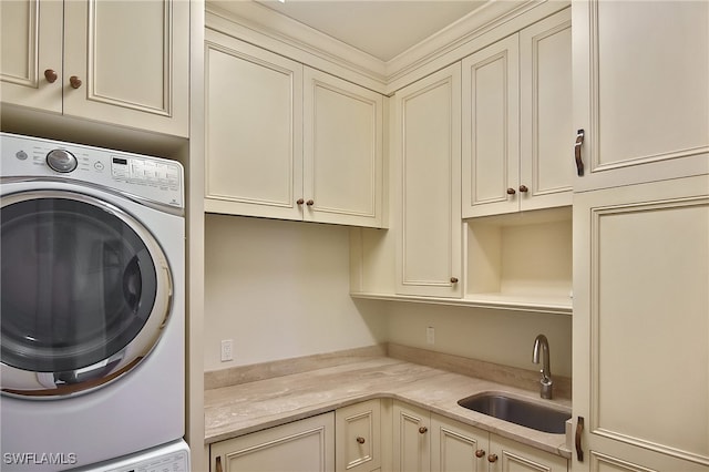 laundry area with sink and cabinets