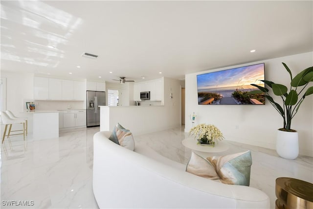 living room featuring ceiling fan