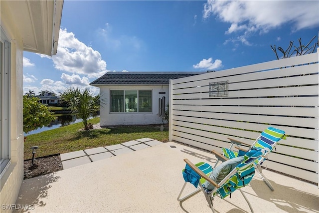 view of patio / terrace with a water view