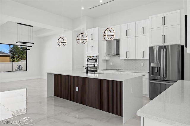 kitchen featuring white cabinetry, decorative light fixtures, an island with sink, and stainless steel fridge with ice dispenser