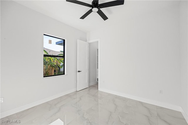 spare room featuring ceiling fan