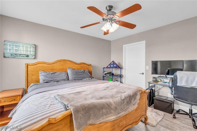 bedroom with ceiling fan and light hardwood / wood-style floors