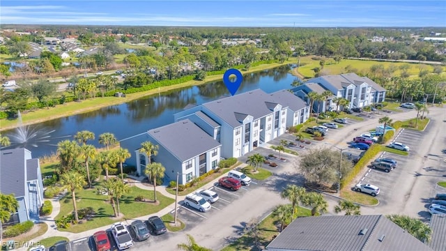 drone / aerial view with a water view