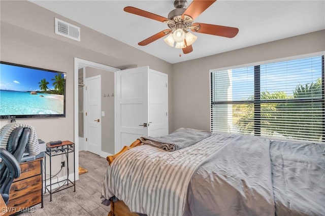 bedroom featuring ceiling fan and light hardwood / wood-style flooring