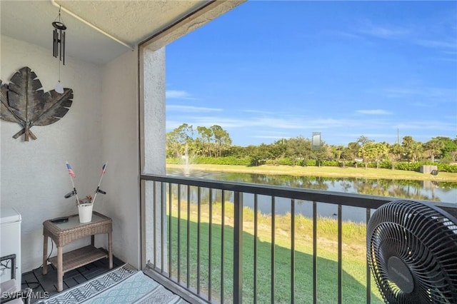 balcony featuring a water view