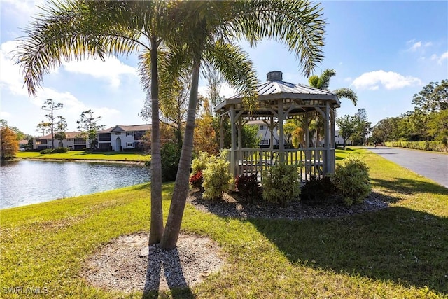 view of yard featuring a gazebo and a water view