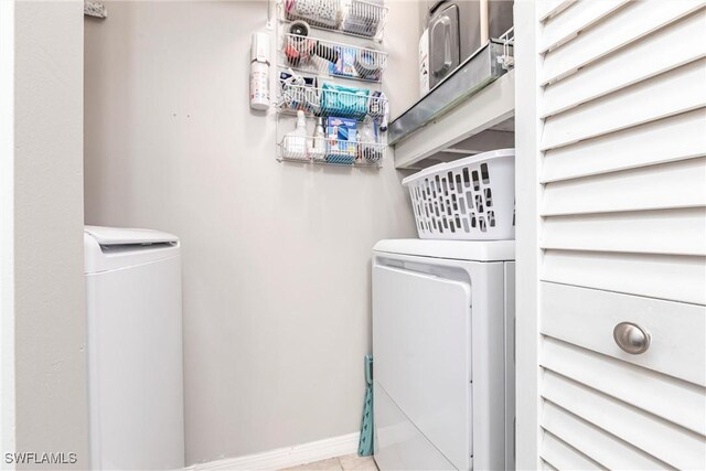 laundry area with washing machine and clothes dryer