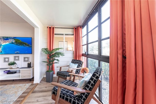 sitting room with hardwood / wood-style floors