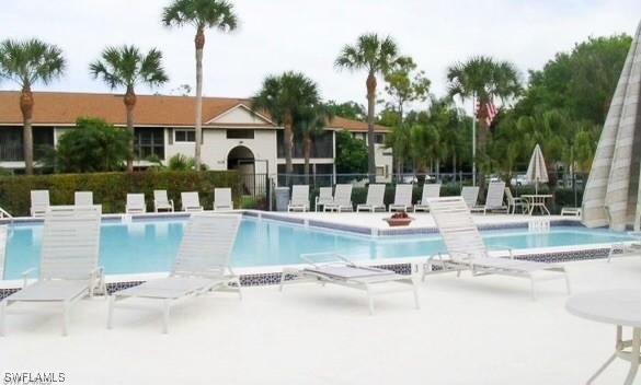 view of swimming pool with a patio and a jacuzzi