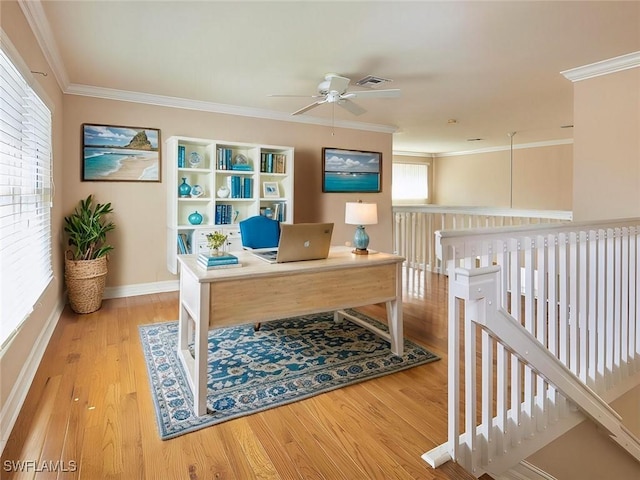 home office featuring wood-type flooring, ornamental molding, and ceiling fan