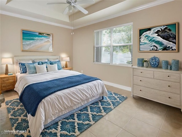 bedroom with a raised ceiling, ornamental molding, light tile patterned floors, and ceiling fan