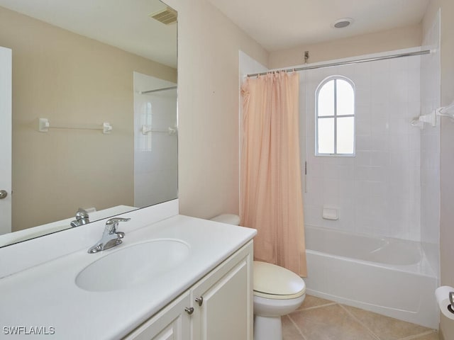 full bathroom featuring shower / tub combo with curtain, tile patterned floors, toilet, and vanity