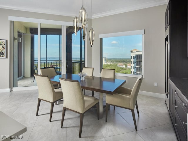 tiled dining room with crown molding and a notable chandelier