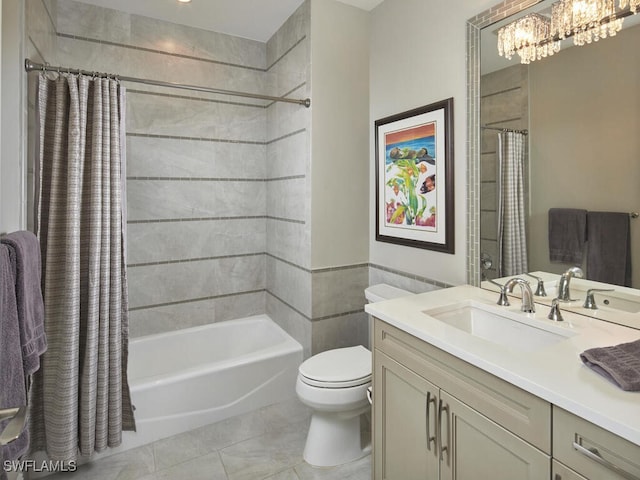 full bathroom with shower / tub combo with curtain, vanity, tile patterned floors, toilet, and a chandelier