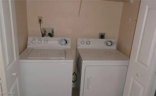 washroom with separate washer and dryer