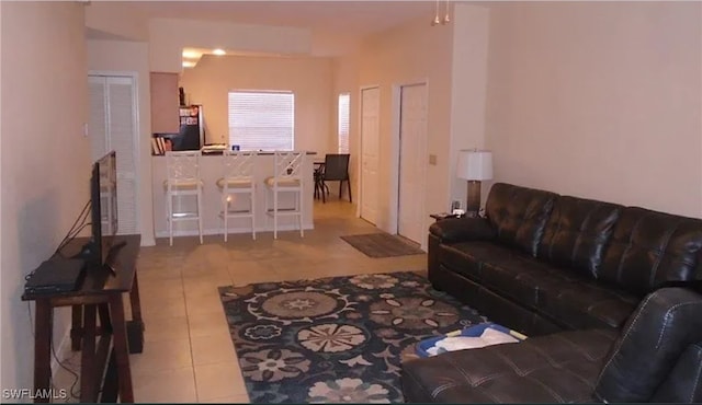 living room with light tile patterned floors