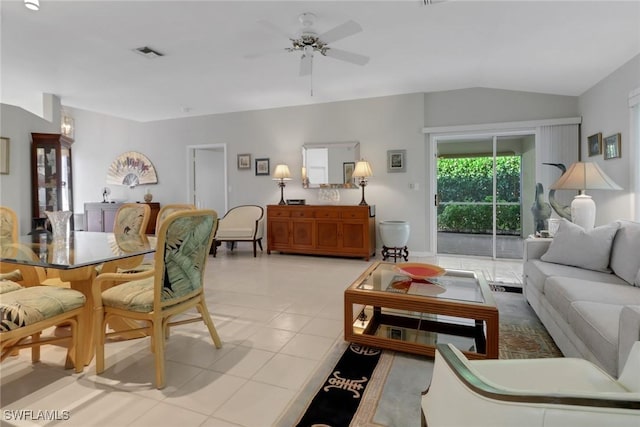 tiled living room featuring lofted ceiling and ceiling fan