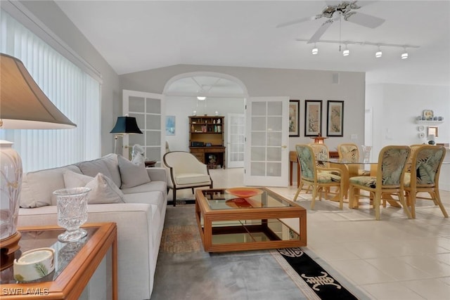 living room with vaulted ceiling and ceiling fan