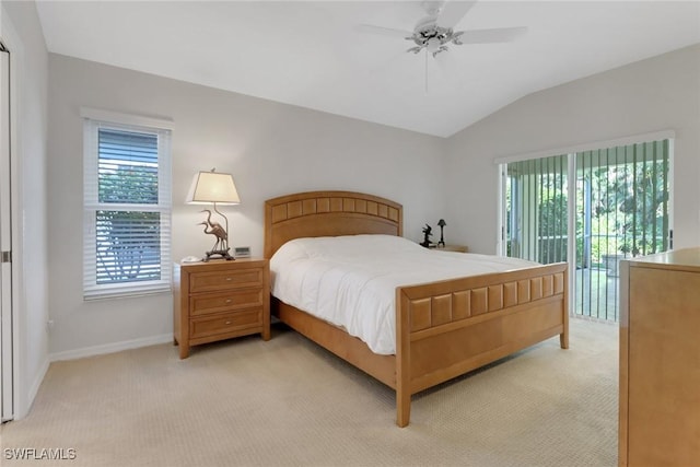 carpeted bedroom with ceiling fan, access to exterior, and vaulted ceiling