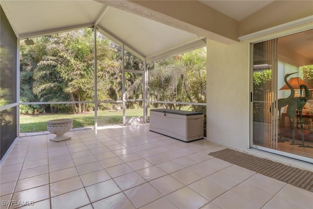 unfurnished sunroom with lofted ceiling