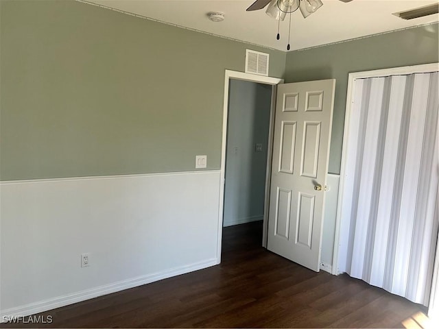 unfurnished bedroom featuring dark hardwood / wood-style flooring