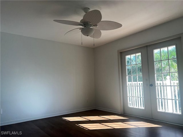 doorway with french doors, ceiling fan, and dark hardwood / wood-style flooring