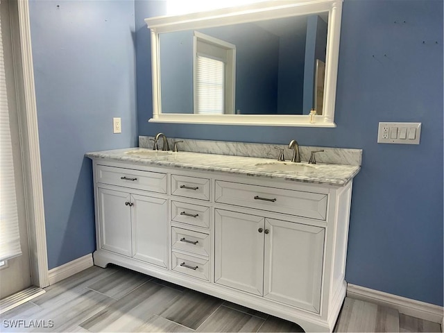 bathroom featuring vanity and hardwood / wood-style floors