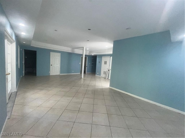 unfurnished room featuring light tile patterned floors