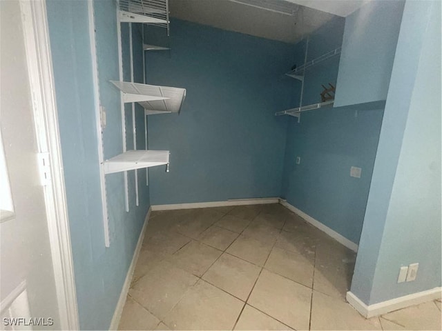 walk in closet featuring tile patterned flooring