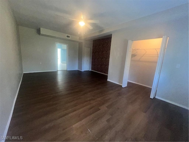 empty room featuring dark hardwood / wood-style flooring