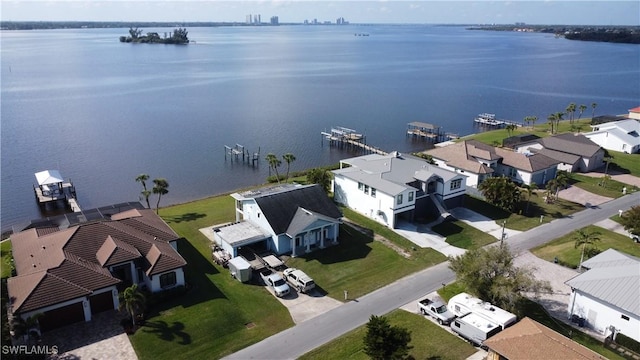 birds eye view of property with a water view