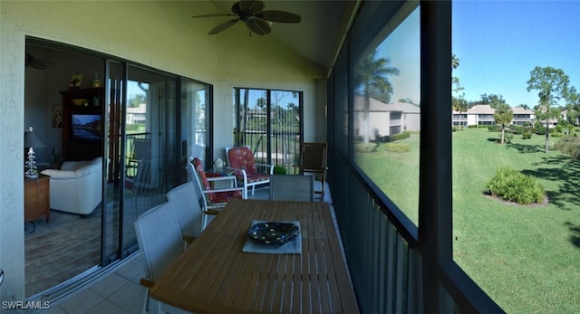 sunroom / solarium with vaulted ceiling and ceiling fan