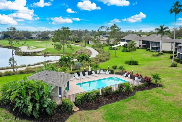 view of pool with a lawn and a patio