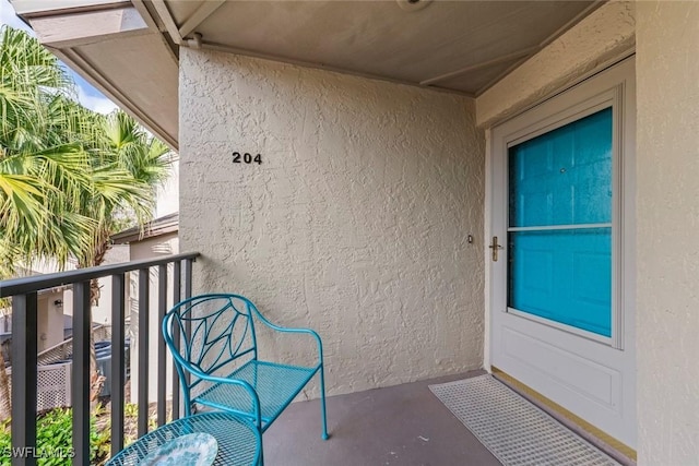 entrance to property featuring a balcony