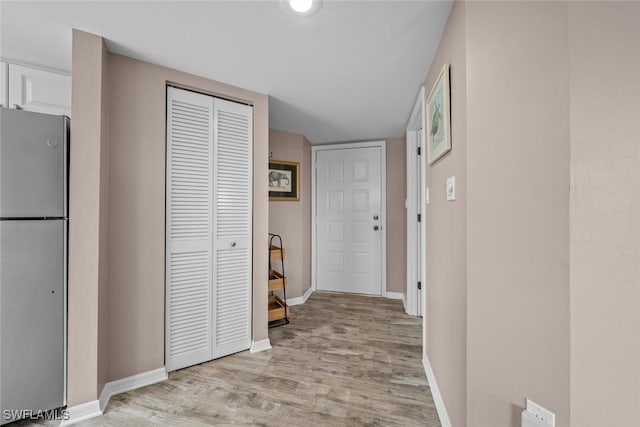 corridor featuring light hardwood / wood-style flooring