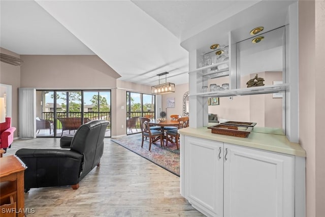 interior space with a chandelier and light hardwood / wood-style floors