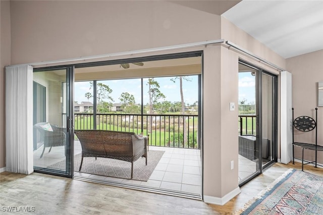 entryway with hardwood / wood-style flooring and vaulted ceiling