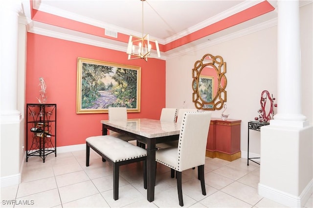 dining room featuring a notable chandelier, light tile patterned floors, ornamental molding, and ornate columns