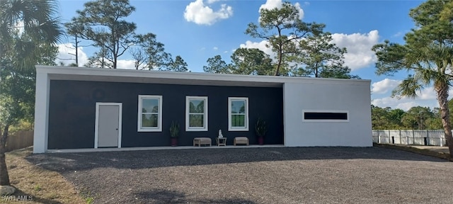 view of outbuilding with fence