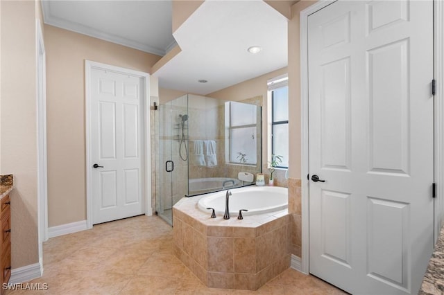 11035 Longwing Dr, Fort Myers, FL 33912 - full bathroom with vanity, a shower stall, a bath, tile patterned flooring, and baseboards