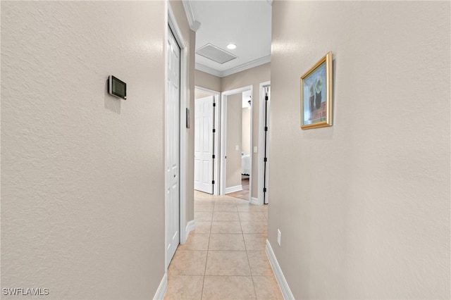 11035 Longwing Dr, Fort Myers, FL 33912 - hallway with light tile patterned floors, a textured wall, baseboards, and crown molding